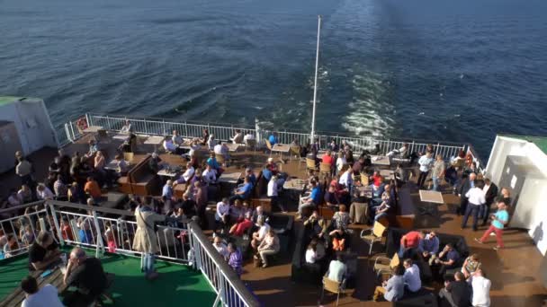 Many passengers drinking in the restaurant at the stern of a large sea ferry "Viking Line". — Stock Video
