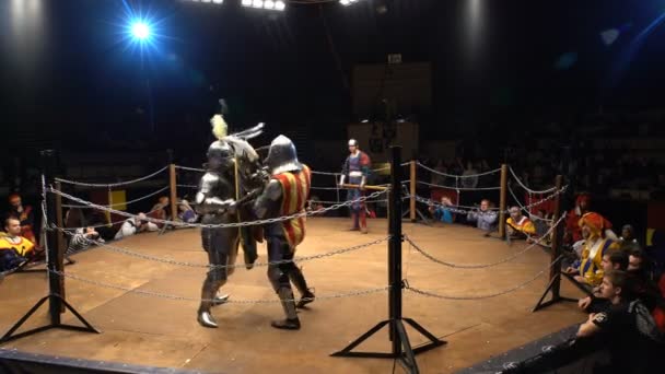 Two Medieval Knights Fighting In The Arena With Clubs And Shields. — Stock Video