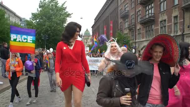 Thousands of people in solidarity during a Gay pride parade on the city streets — Stock Video