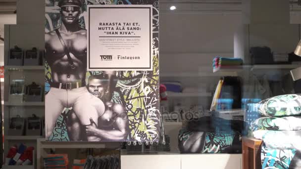 Collection of bed linen with homoerotic prints by Tom Of Finland in a shop window. — Stock Video