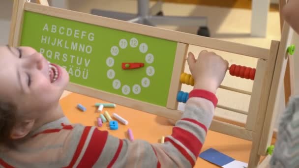 Little girl doing math exercises with her mother at home — Stock Video