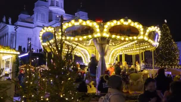 Children merry-go-round at Christmas market on Senat Square, Helsinki. — Stock Video