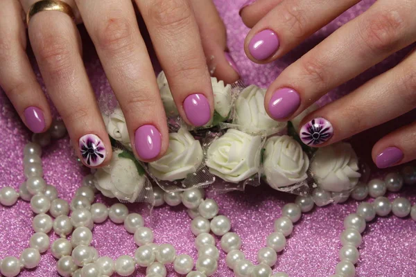 Elegant manicure design lilac with a pattern — Stock Photo, Image