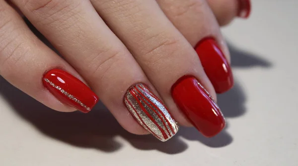 Nail designs with different sequins in the shape of hearts on red and pink nails for — Stock Photo, Image
