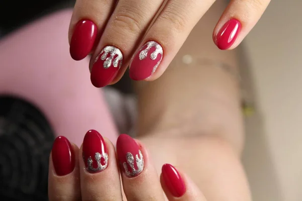 Red manicure design with silver — Stock Photo, Image