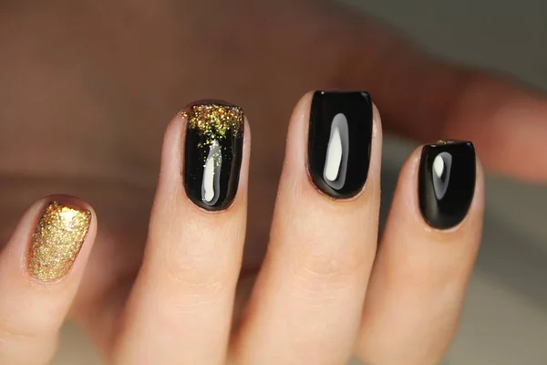 Manicure design black and gold color — Stock Photo, Image