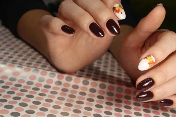 brown manicure with coffee beans