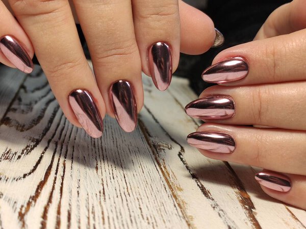 Autumn manicure. Beautyful nails design with autumn leaves.