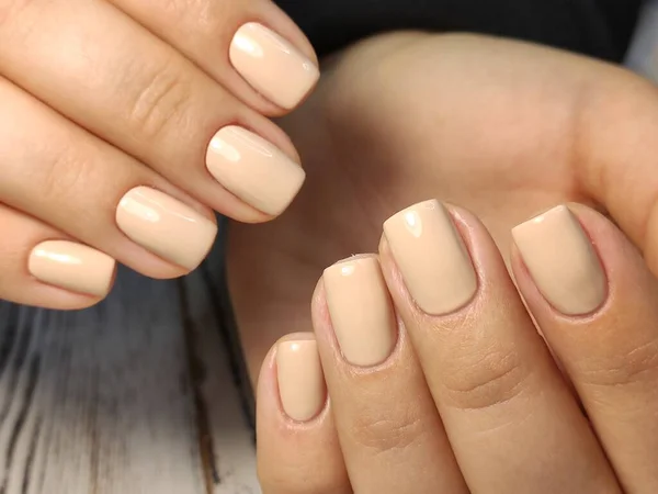 Hands Care. Hand With Pastel Nails In Sea Salt. Close Up Of Woman Hand With White Manicure In Pink Sea Salt.