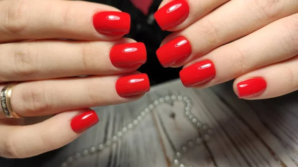 Manicured nails colored with red nail polish — Stock Photo, Image