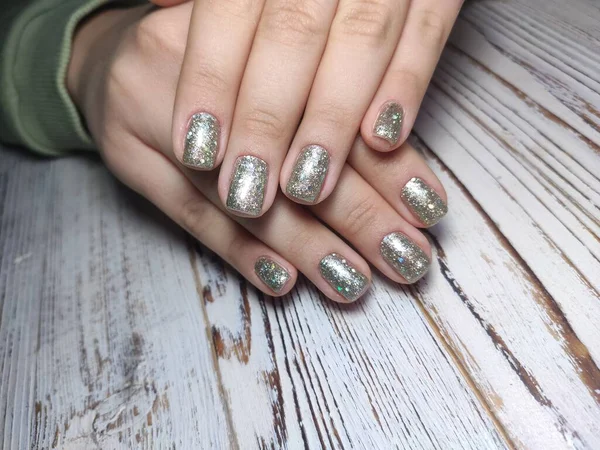 Partial view of manicurist gently holding hand — Stock Photo, Image