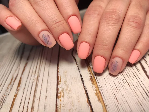 Trendy manicure design on a beautiful textural background.