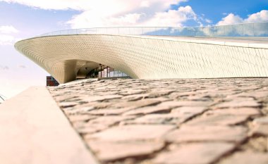 Museum of Art, Architecture and Technology in Lisbon. Architect Amanda Leveta. The building is located near the water, overlooking the bridge 