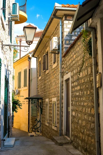 stock image Winding street of the authentic, old town of Herceg Novi, Montenegro. We see old houses and very narrow.