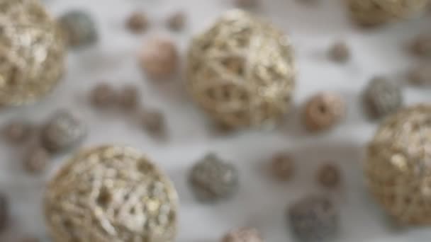 Christmas composition. Golden vine balls. 4K resolution dolly shot. Shallow depth of field. — Stock Video