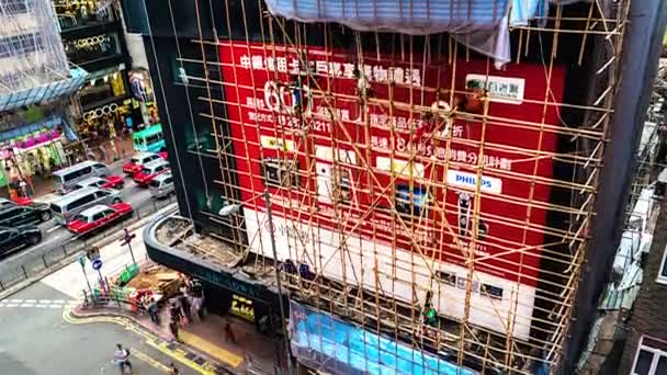 HONG KONG -竹の足場を解体する人々のタイムラプス。4K解像度の傾き. — ストック動画