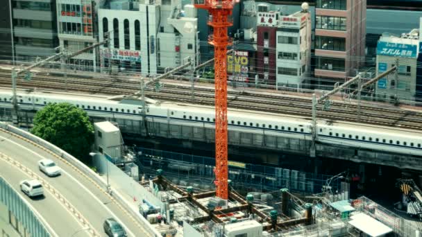 Tokio - Vista aérea de la ciudad con trenes que pasan. Ginza. 4K resolución aspecto retro — Vídeo de stock