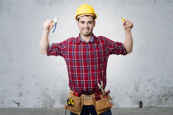 Bygningsarbeideren – stockfoto