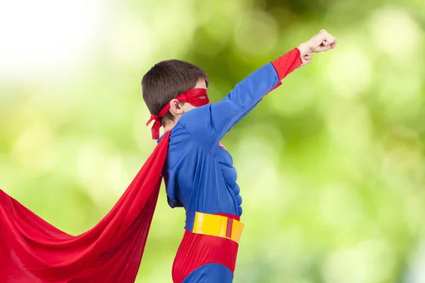 Superhero and the arm up — Stock Photo, Image