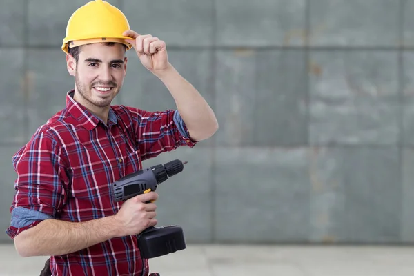 Bauarbeiter mit dem Bohrer — Stockfoto