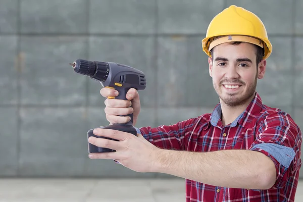 Builder with the drill — Stock Photo, Image