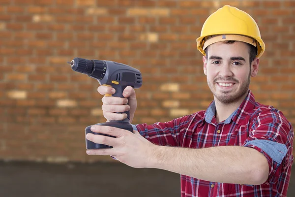 Builder with the drill — Stock Photo, Image