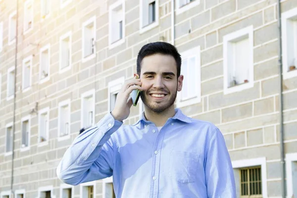 Young speaking by phone Stock Image