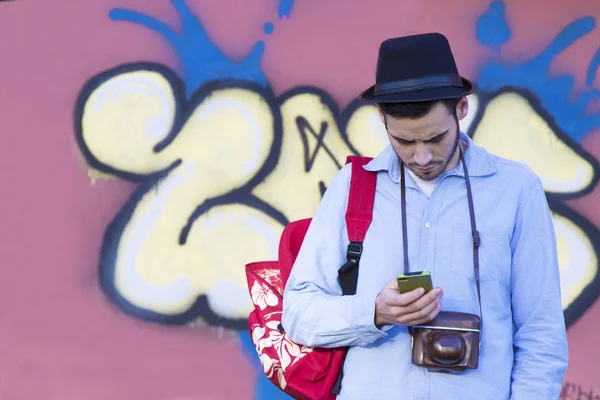 Young man with mobile phone — Stock Photo, Image