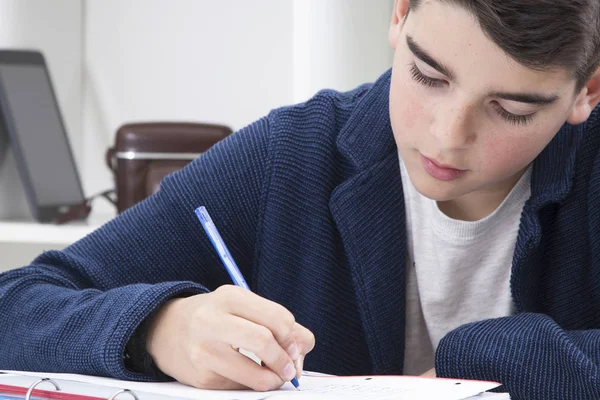 Child writing in the book — Stock Photo, Image