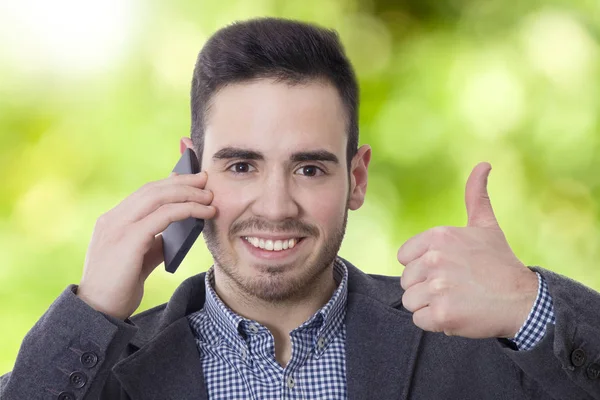 Homem de negócios com telefone móvel — Fotografia de Stock