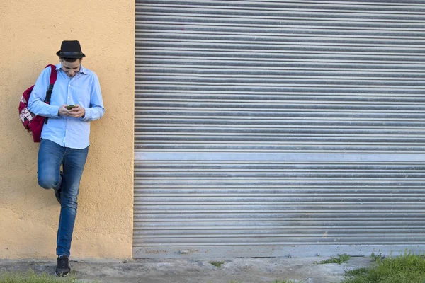 Young man with mobile phone — Stock Photo, Image