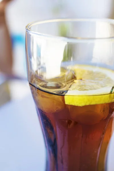 Glass of cola with lemon — Stock Photo, Image