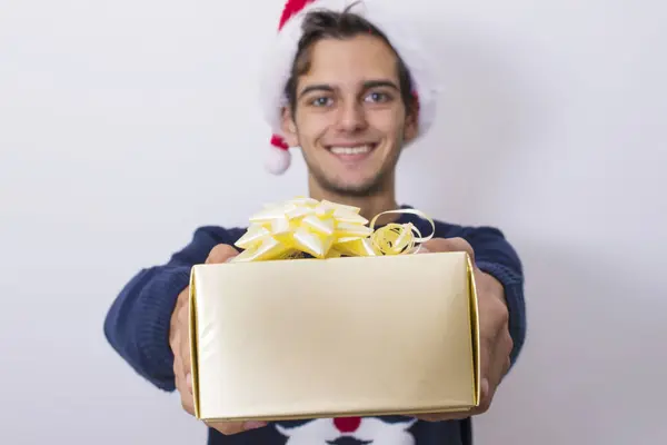 Young man with christmas gift — Stock Photo, Image