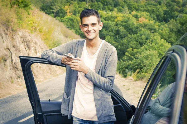 Man with car and mobile — Stock Photo, Image