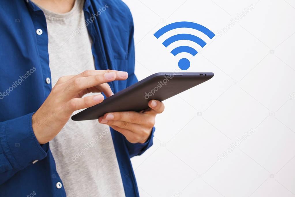 hands with the computer or tablet and the wifi signal