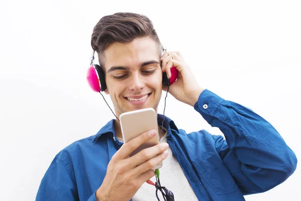 Junger Moderner Teenager Mit Telefon Und Kopfhörer Der Musik Hört — Stockfoto