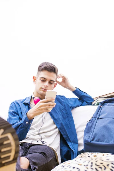 Teenager Lying Listening Music Mobile Phone Headphones — Stock Photo, Image