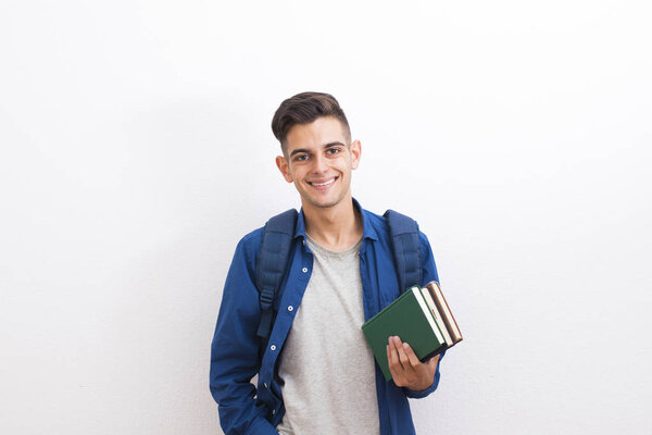 teenager college student with books on white background