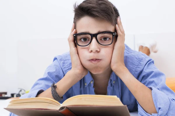 young student with expression of stress and burden with books