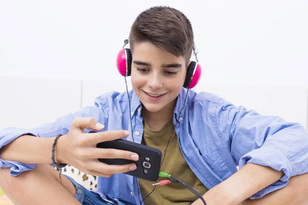 Teenage Boy Mobile Phone Headphones Listening Music — Stock Photo, Image