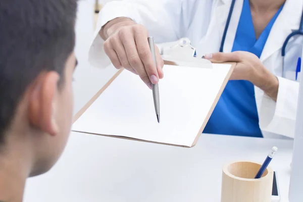 doctor with pen to sign the contract