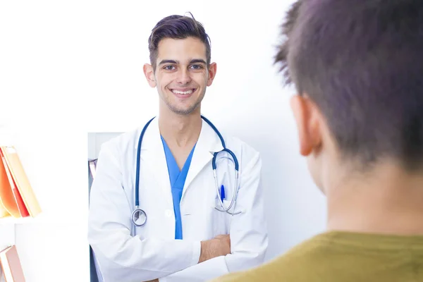 family doctor with patient in consultation