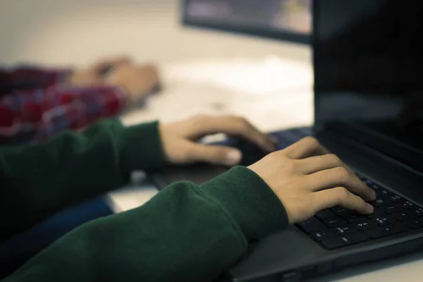 young people with the computer at home