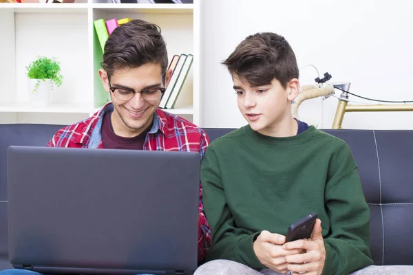 young people at home with laptop