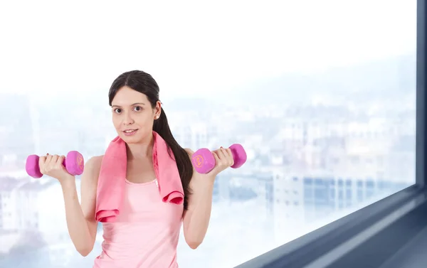 woman doing sport with dumbbells, fitness