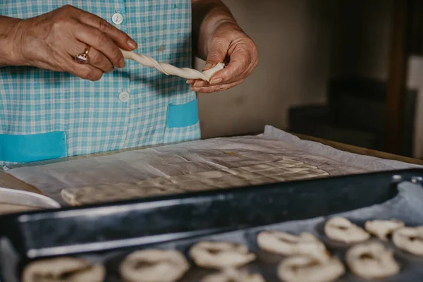 hands cooking making donuts or traditional sweets