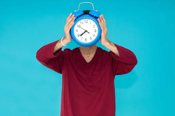 man with alarm clock or alarm isolated on color background