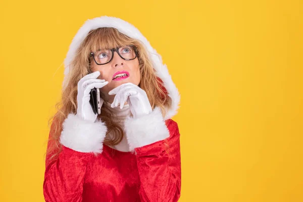 santa claus woman with mobile phone isolated on color background