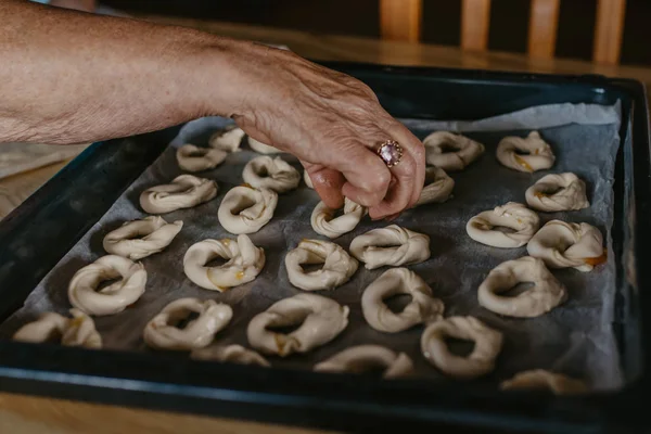 woman hands preparing traditional cakes and sweets