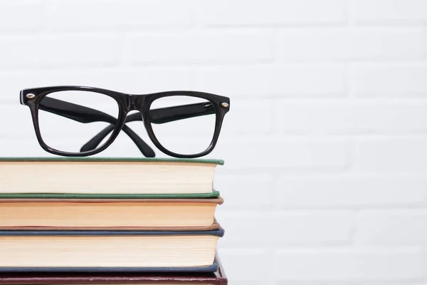 Glasses Top Stacked Books — Stock Photo, Image